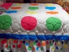 quilt-on-bed-with-ruffles-resized