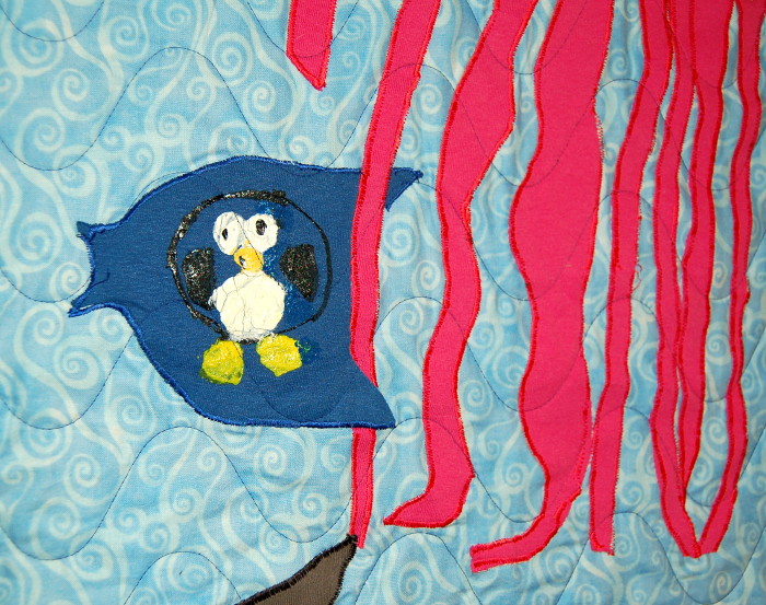 Jellyfish and unknown fish appearing in Seascape T-Shirt Quilt