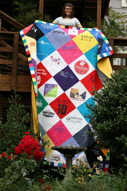 Taylor displaying her quilt